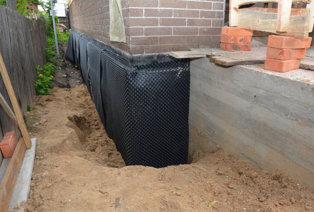 Happy homeowners after waterproofing job in Newtonville